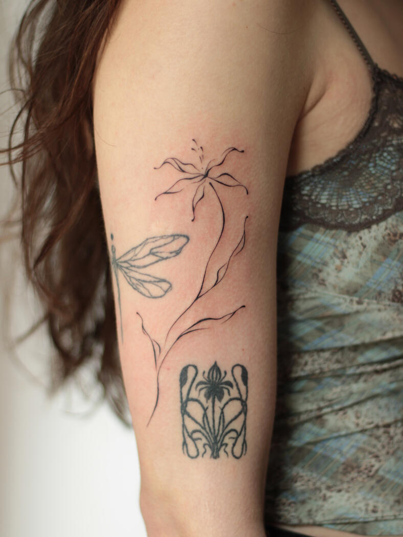 Fine line abstract flower tattoo by queer artist in lisbon